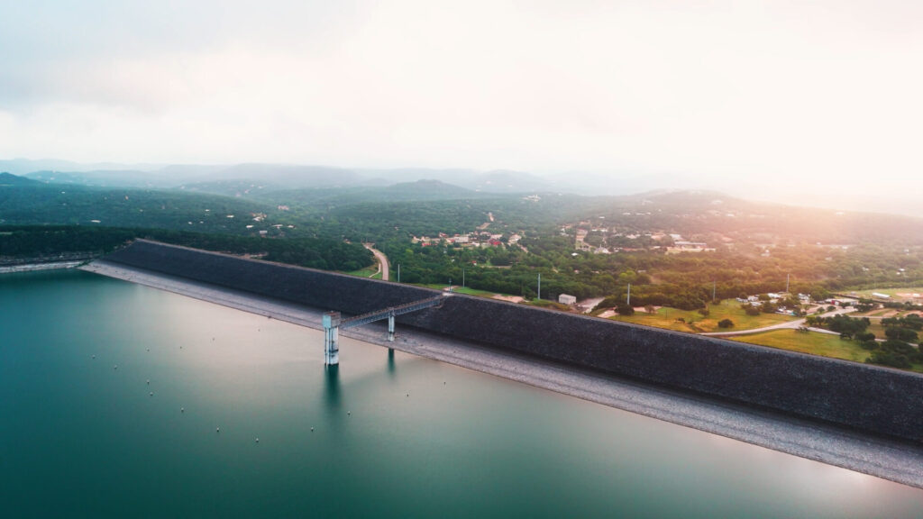 Canyon Lake dam and reservoir in the Texas Hill Country showing watershed modification and water storage.